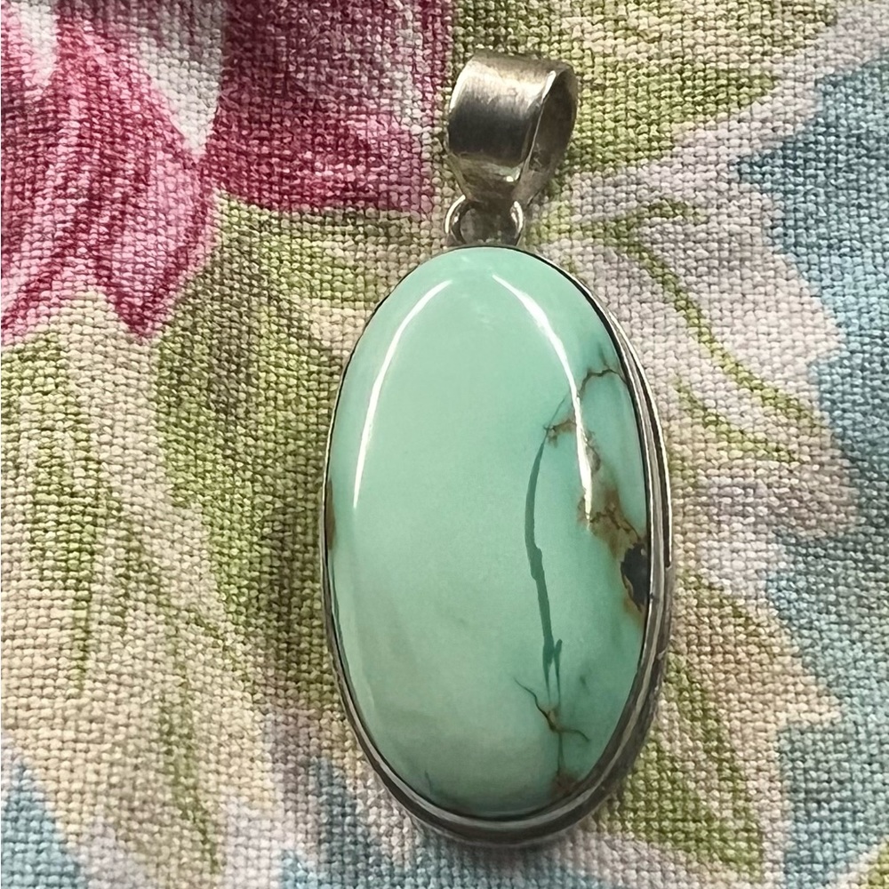 Sterling pendent with turquoise.